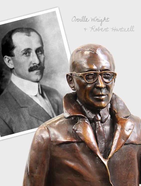 Photo of Orville Wright next to statue of Robert Hartzell